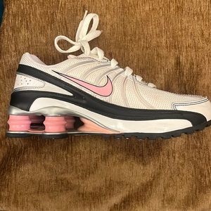 Nike Shock Shoes . 5.5 Youth which equates 7.5 women size . Pink/black and white